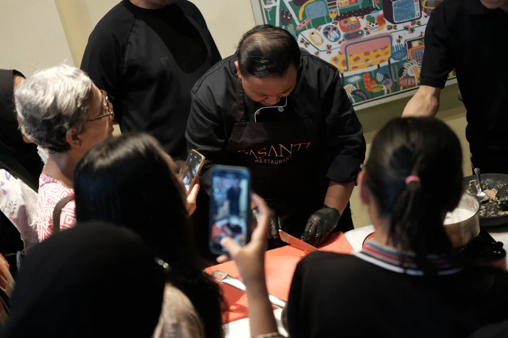 Chef Krisna demonstrates how Buntil Salmon is made